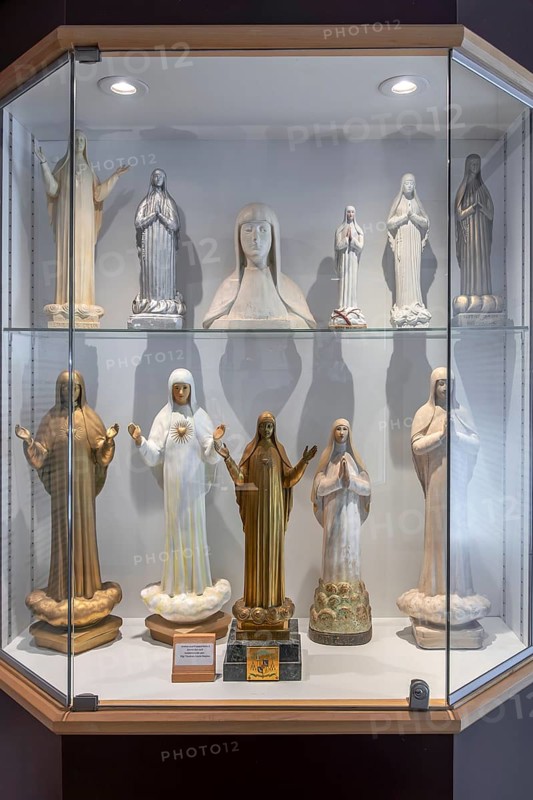 Religious statuettes in museum near Our Lady of Beauraing, Notre-Dame de Beauraing sanctuary, place of pilgrimage at Beauraing, Namur, Belgium