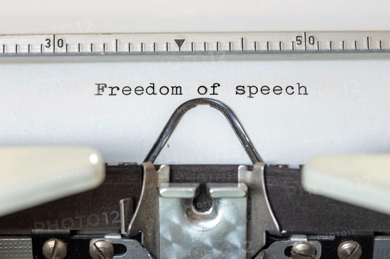 FREEDOM OF SPEECH, written with a typewriter