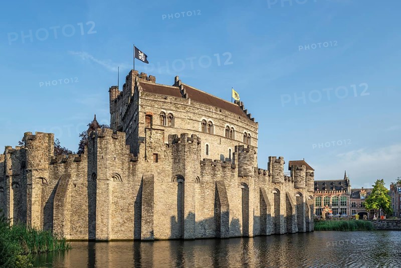 12th century medieval moated Gravensteen, castle of the counts in the historic city centre of Ghent in summer, East Flanders, Belgium