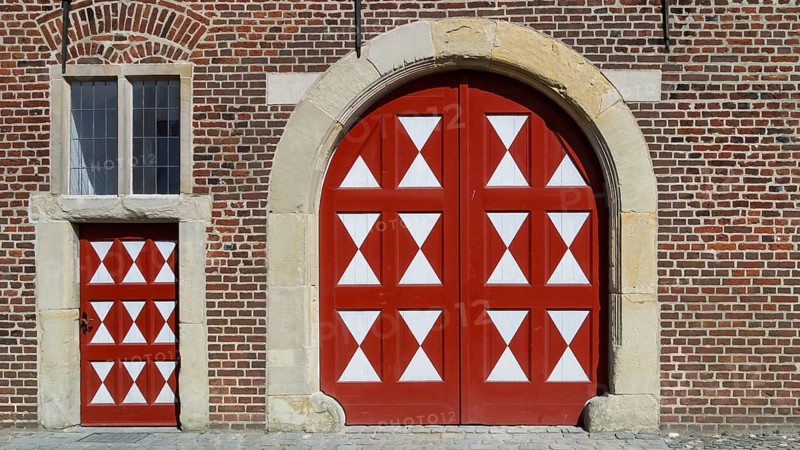 Historic moated castle, Renaissance Raesfeld Castle, façade with one Tor tor and one door, Freiheit Raesfeld, Münsterland, North Rhine-Westphalia, Germany