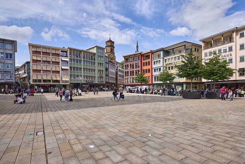 Square, church tower of the collegiate church Stuttgart, trees, pavement slabs, pedestrians as accessories, blue sky, cumulus clouds, cirrostratus clouds, market square, Stuttgart, state capital, city district Stuttgart, Baden-Württemberg, Germany