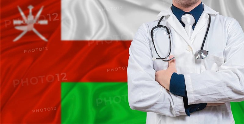 Male doctor with stethoscope on Maldivian flag. Doctor holding stethoscope on Maldives flag