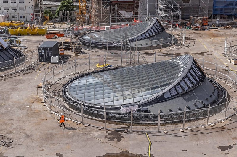 Stuttgart 21 construction site at the main station. View of the glass eyes of the future underground through station. 27 light eyes will illuminate the new underground through station. Façade construction specialist Seele is currently installing the glass, steel and aluminium construction in a complex process. The light eyes have a diameter of up to 21 metres. Stuttgart, Baden-Württemberg, Germany