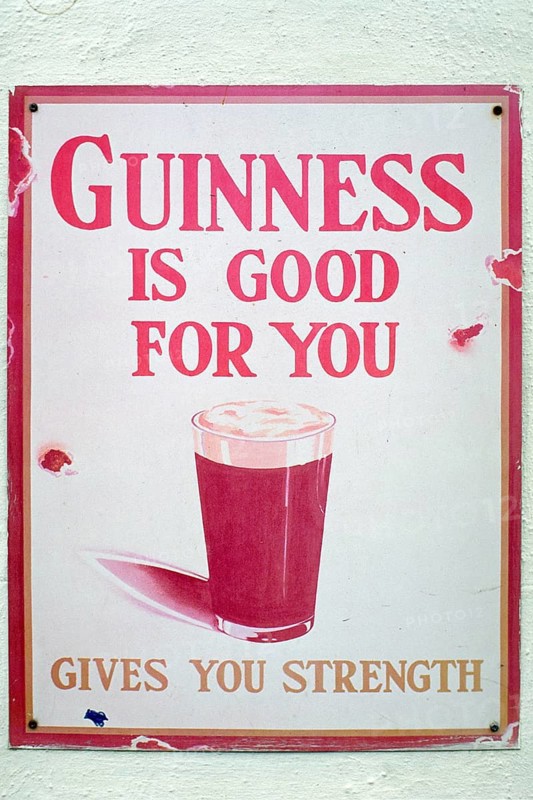 Old metal sign for Guinness beer, London, England, Great Britain