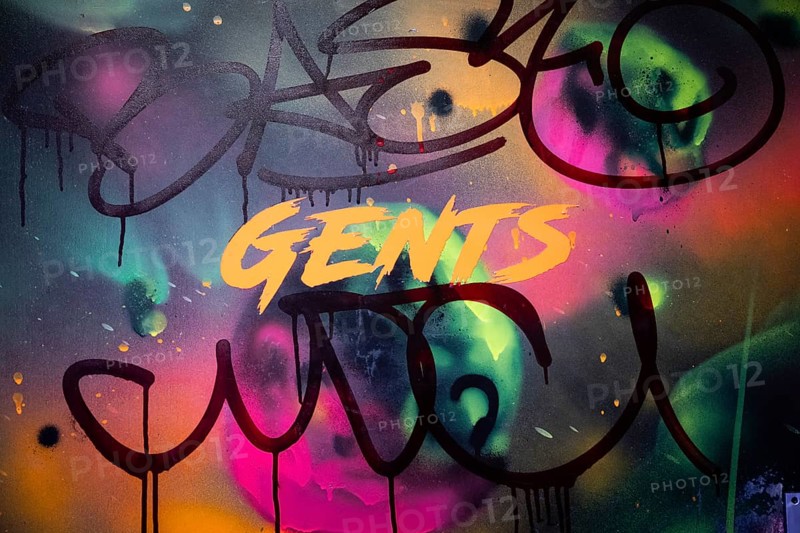 Graffiti on toilet door and lettering 'GENTS', neon colours, London, England, Great Britain