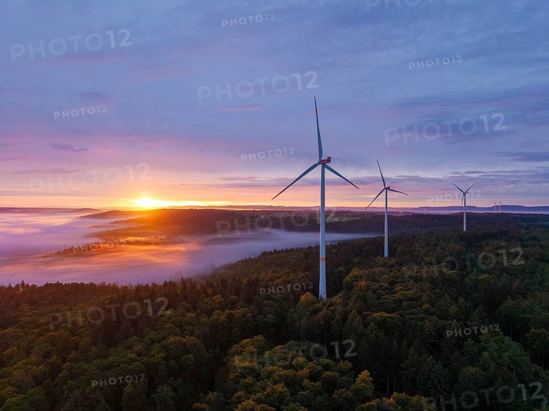 Wind turbines above a fog-covered forest in golden sunlight, sunrise, near Schorndorf, Rems-Murr district, Rems-Murr-Kreis, Baden-Württemberg, Germany
