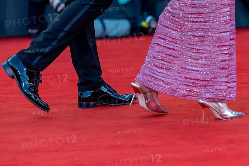 Venice, Italy - 2 September 2025: Tuxedo trousers, dinner jacket shoes and high heels during the red carpet of - A house of Dynamite - during the 82nd Venice International Film Festival