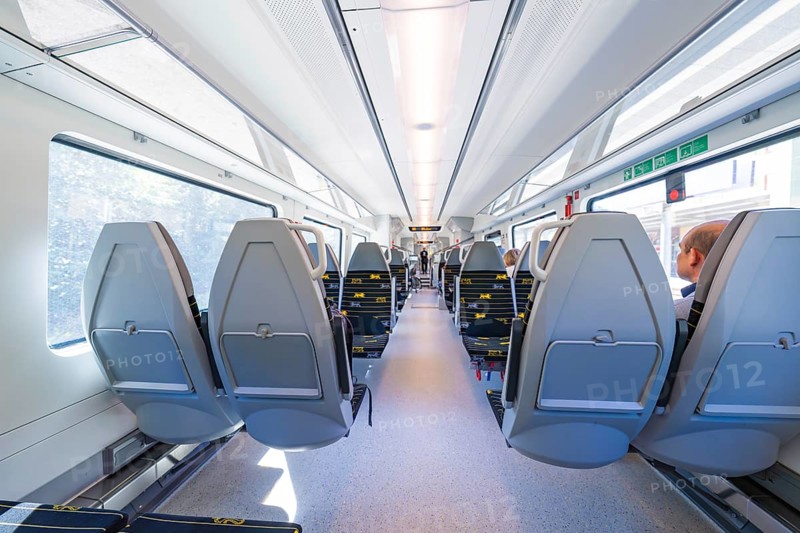 Spacious and modern train compartments with rows of window seats, battery Electric train with green electricity, Siemens Mireo Plus B, Freudenstadt, Germany