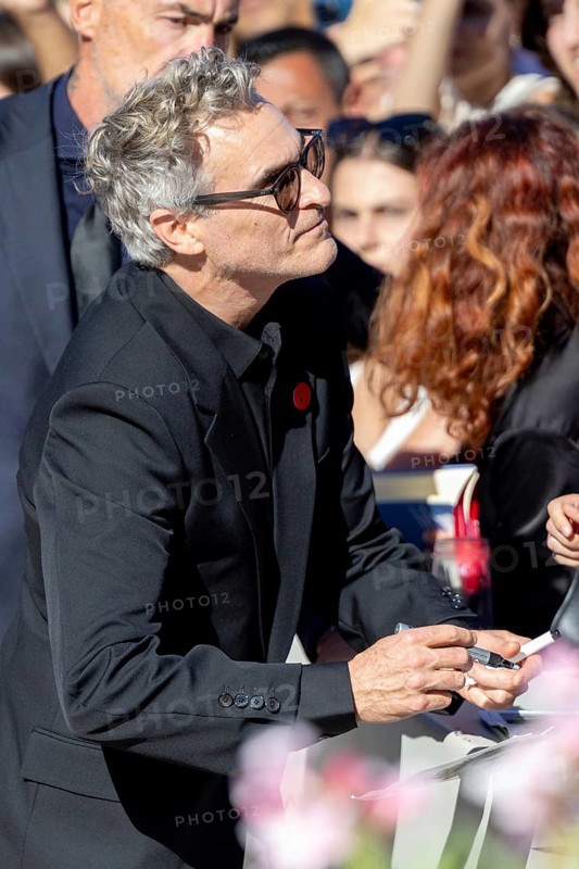 Venice, Italy - 3 September 2025: Joaquin Phoenix signing autographs during the Red Carpet of - The Voice Of Hind Rajab - during the 82nd Venice International Film Festival