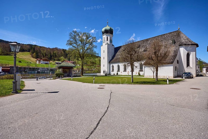 Parish church Herz-Jesu Bischofswiesen, lantern, meadow, hill, forest, trees, blue sky, cirrostratus clouds, town hall square, Bischofswiesen, district Berchtesgadener Land, Bavaria, Germany