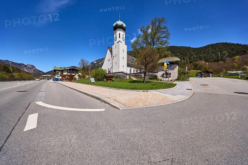 Parish church Herz-Jesu Bischofswiesen, church, trees, lawn, hill, coniferous forest, blue sky, cirrostratus clouds, crossing of federal road 20 with town hall square, Bischofswiesen, district Berchtesgadener Land, Bavaria, Germany