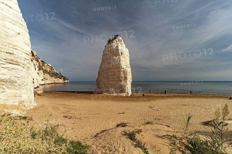 Pizzomunno rock on the Spiaggia di Castello beach in Vieste, Gargano, Apulia, Italy