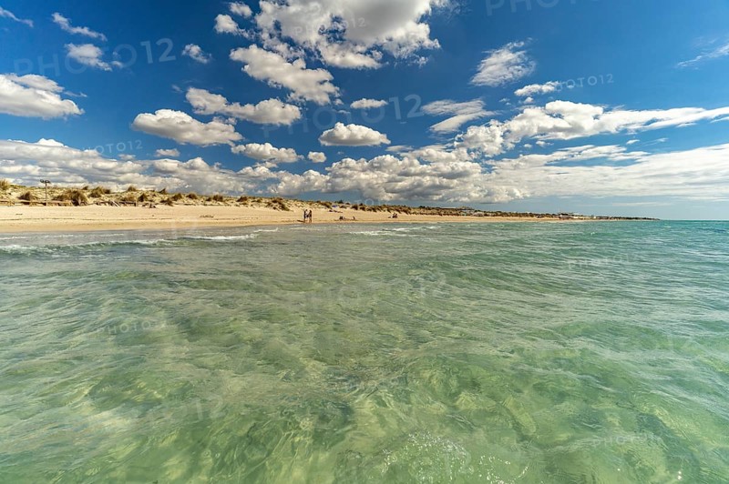 Crystal-clear turquoise water on the beach at Torre San Giovanni, Marina di Ugento, Apulia, Italy