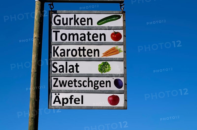 Sign of a farm shop at a farm, offering cucumbers, tomatoes, carrots, lettuce, plums, apples, Grosswangen, Canton Lucerne, Switzerland