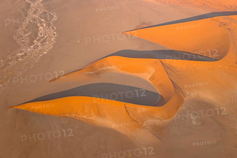 Sand dunes in the Namib Desert. In the evening. Aerial view. Namib-Naukluft Park, Namibia