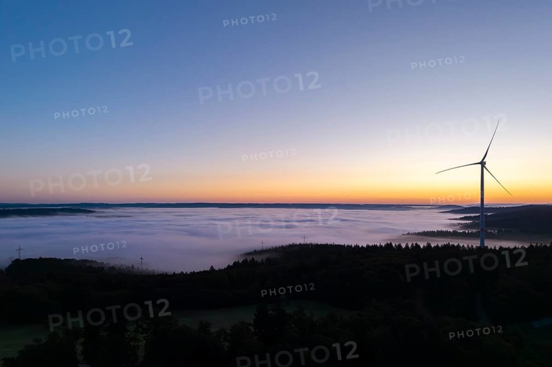Single wind turbine with fog at sunrise along the horizon, near Schorndorf, Remstal, Rems-Murr-Kreis, Baden-Württemberg, Germany