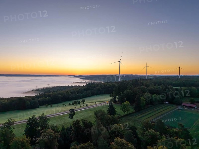 Expansive landscape with wind turbines and a veil of mist at dawn, near Schorndorf, Rems-Murr district, Rems-Murr-Kreis, Baden-Württemberg, Germany