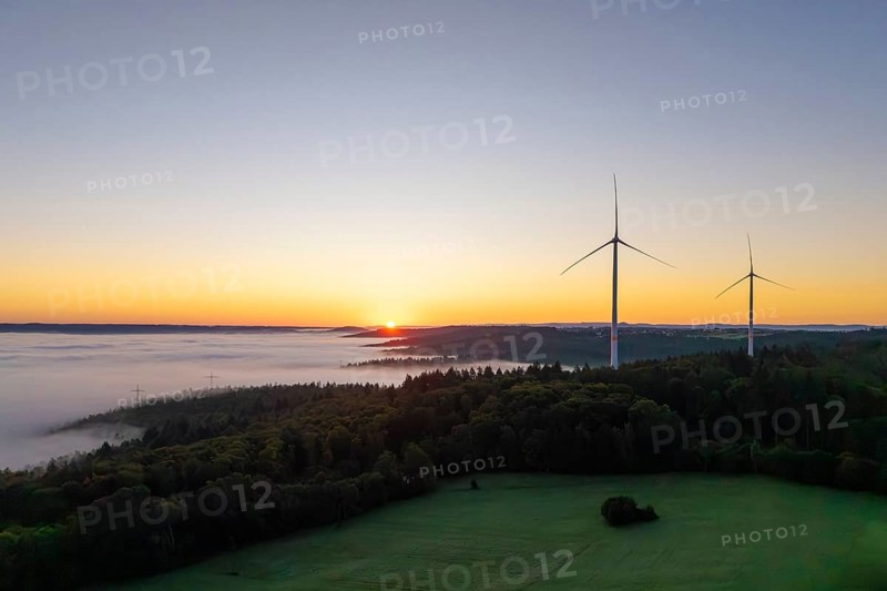 Sunrise over a foggy landscape with visible wind turbines, near Schorndorf, Remstal, Rems-Murr-Kreis, Baden-Württemberg, Germany