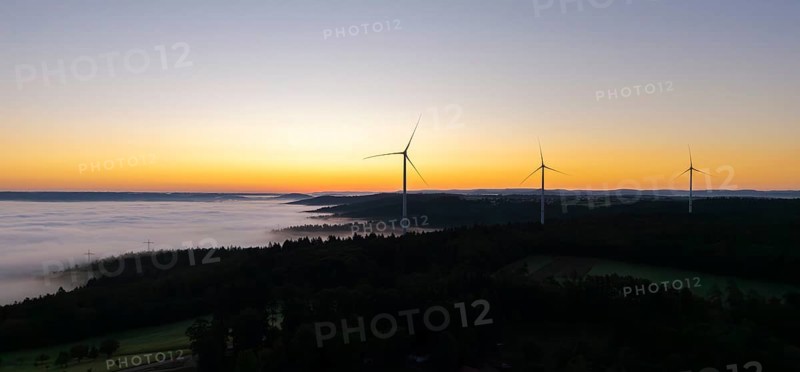 Several wind turbines above a foggy landscape at sunrise, near Schorndorf, Rems-Murr district, Rems-Murr-Kreis, Baden-Württemberg, Germany