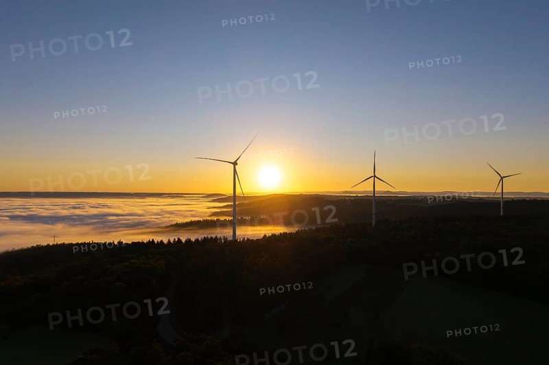 Wind turbines above a misty landscape at sunrise, near Schorndorf, Rems-Murr district, Rems-Murr-Kreis, Baden-Württemberg, Germany