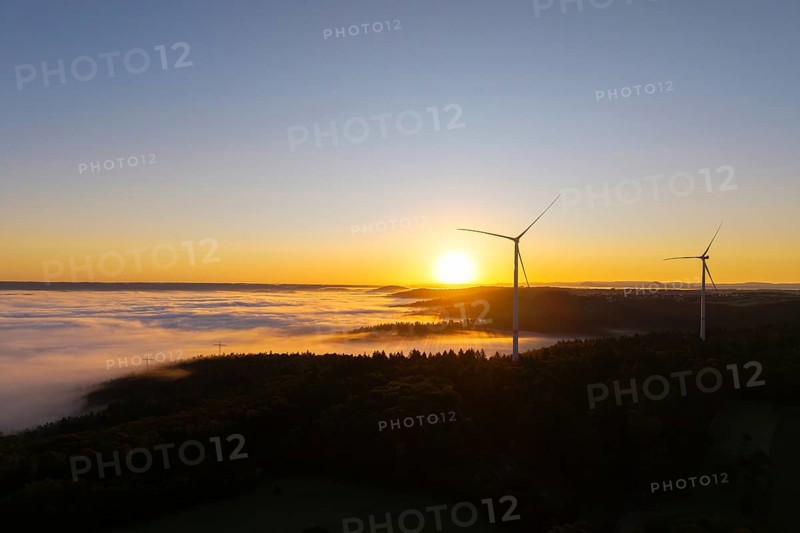 Wind turbines over foggy fields and hills at sunrise, near Schorndorf, Rems-Murr-Kreis, Rems-Murr-Kreis, Baden-Württemberg, Germany