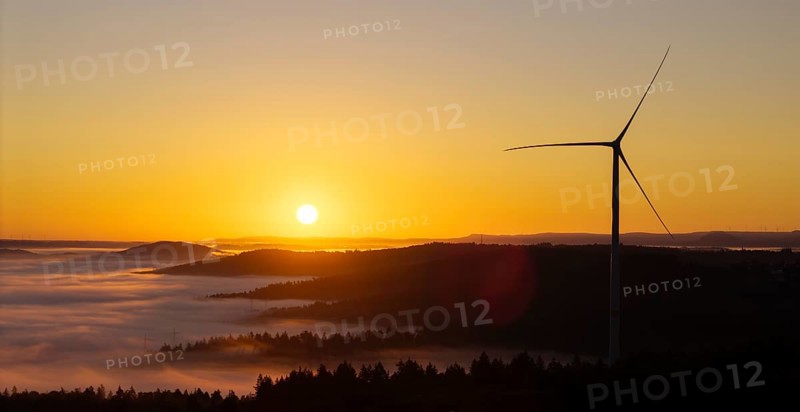 Wind turbine in front of a picturesque sunrise over a misty landscape, near Schorndorf, Remstal, Rems-Murr-Kreis, Baden-Württemberg, Germany