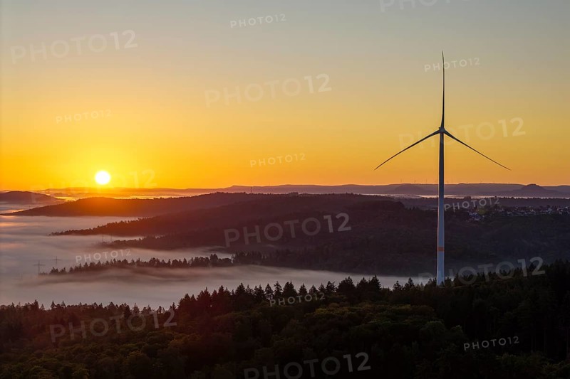 Wind turbine at sunrise over a misty hilly landscape, near Schorndorf, Rems-Murr district, Rems-Murr-Kreis, Baden-Württemberg, Germany