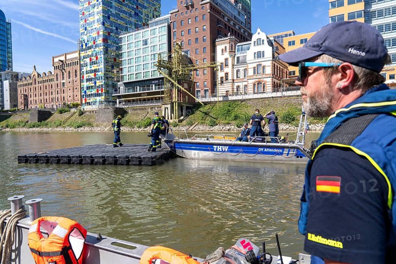 Transport of a floating platform with the jet-float system, this can be used as a work platform, jetty or bridge, water hazards specialist group, multi-purpose boat accompanied, in Düsseldorf, at the major exercise FÜLEX25, lasting several days, of the THW, Federal Agency for Technical Relief, North Rhine-Westphalia, over 3500 volunteers from the 127 North Rhine-Westphalia local associations practise many different deployment scenarios over 4 weekends