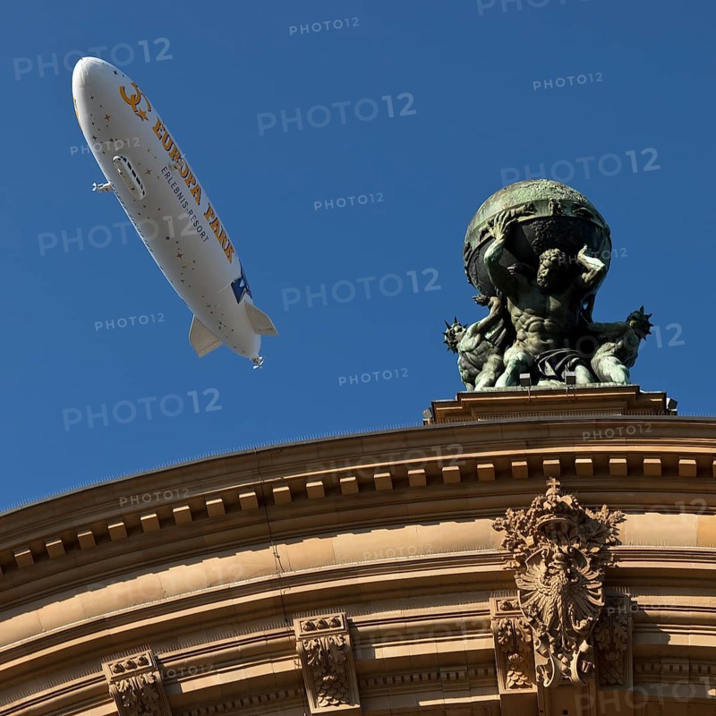 Main front of the main railway station with Atlas carrying the globe on his shoulders and a zeppelin, Frankfurt am Main, Hesse, Germany