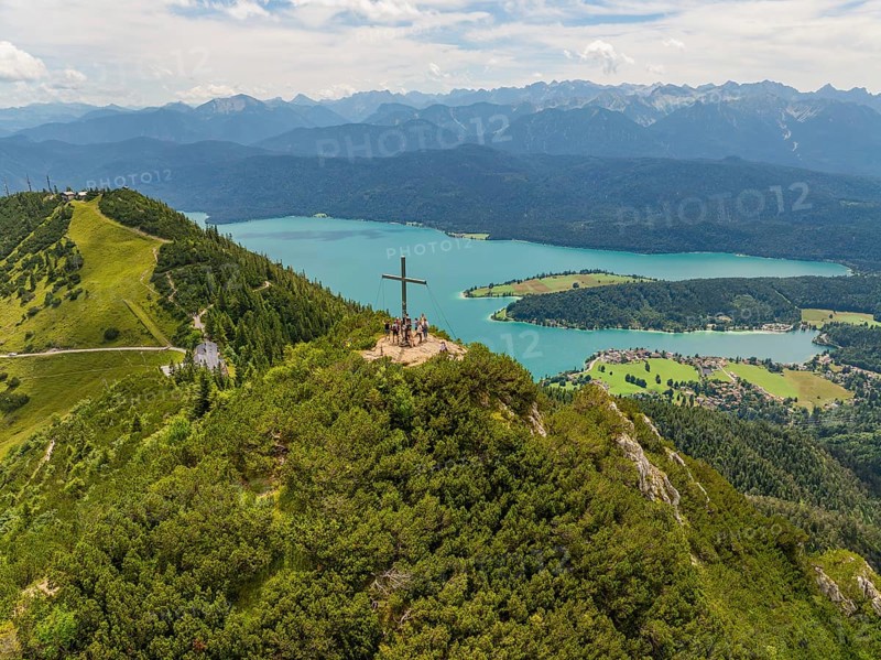 Panoramic view over a mountain and lake landscape with a cross on the summit, Herzogstand summit, Walchensee, Schlehdorf, Germany