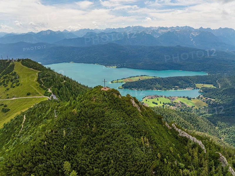 Panorama of a mountain and lake landscape with a summit cross in the foreground, Herzogstand summit, Walchensee, Schlehdorf, Germany