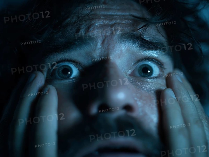 A close-up of a man whose face is marked by fear, symbolising anxiety disorders, panic attacks, mental illness, AI generated, AI generated