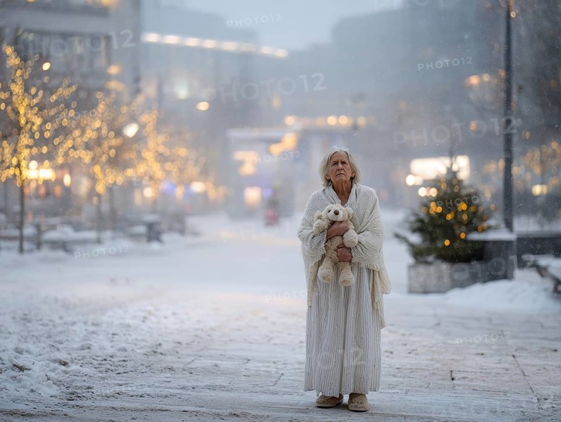 An elderly woman in a nightgown stands with her teddy bear in a cold, wintry environment, looking confused, helpless and disorientated, symbolising dementia, Alzheimer's, AI generated
