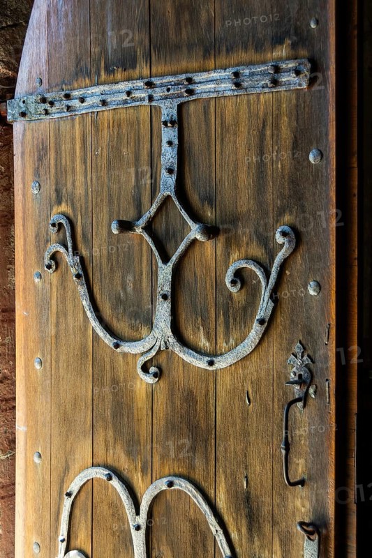 Compains, ironwork detail on the entrance door, Saint Georges church, Auvergne Volcanoes Regional Park, Cezallier region, Puy de Dome, Auvergne Rhone Alpes, France