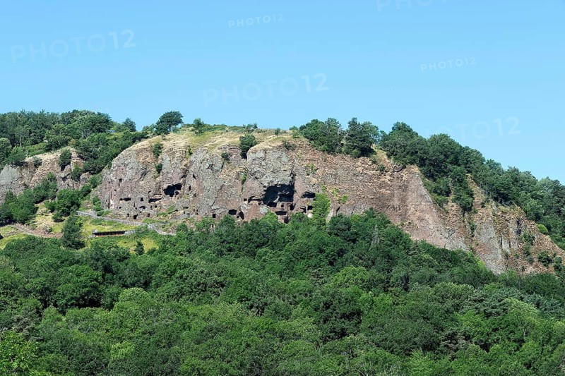 Jonas caves are nestled on a rocky cliff near Saint Pierre Colamine, Puy de Dome in Auvergne, France
