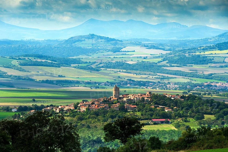 Village of Montpeyroux labelled Les Plus Beaux Villages de France and view on Sancy massif, Puy de Dome, Auvergne-Rhone-Alpes, France