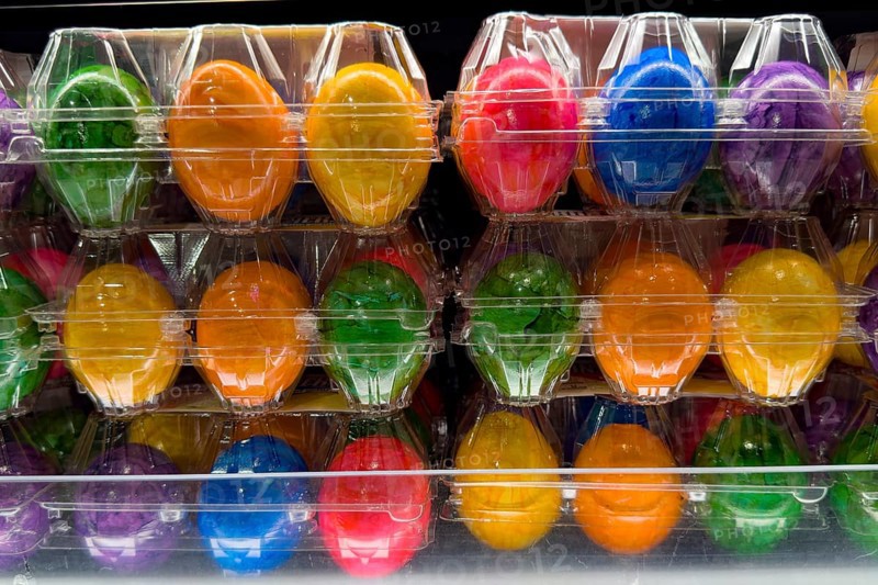 Colourful dyed hard-boiled eggs Easter eggs in plastic blister packs for year-round retail sale, Germany