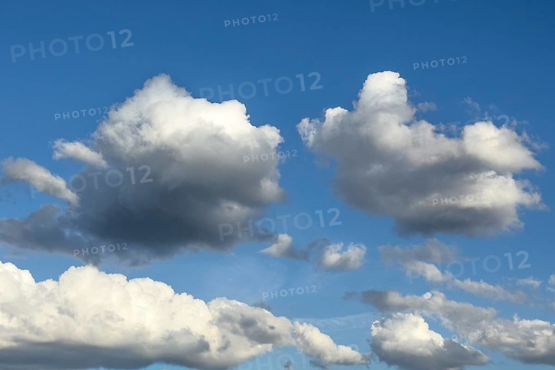 Photo from above two altocumulus clouds cluster clouds below in the background white stratocumulus cumulus clouds cloud in front of bright blue sky, international