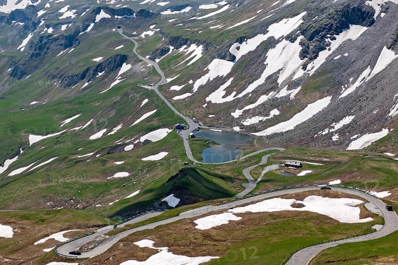 View from Edelweiss ridge to mountain pass Alpine pass Alpine mountain road Alpine road Pass road Pass road Pass old Grossglockner High Alpine Road Grossglockner High Alpine Road, in front serpentines narrow bends with cobblestones, in the background on the right small lake Fuscher Lacke, behind it road to Mittertörl, Carinthia, East Tyrol, Austria