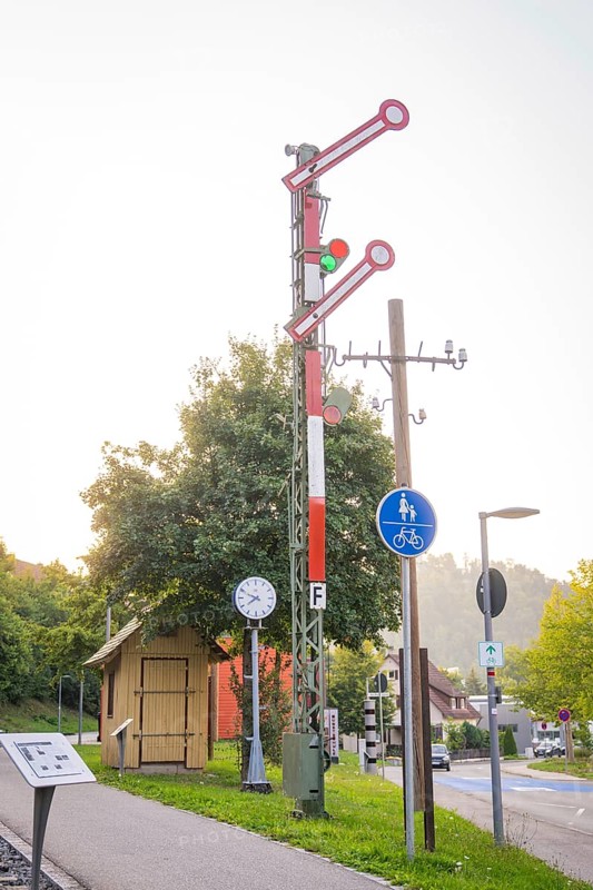 Old railway signal and traffic signs in an urban environment, small town of Perle Nagold, Black Forest, Germany