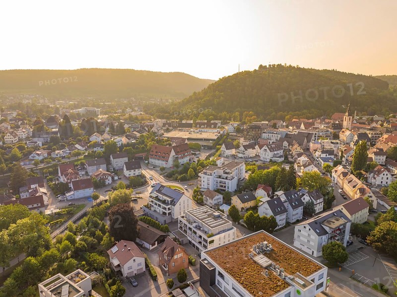 Idyllic town view at sunset with green hills and houses, small town pearl Nagold, Black Forest, Germany