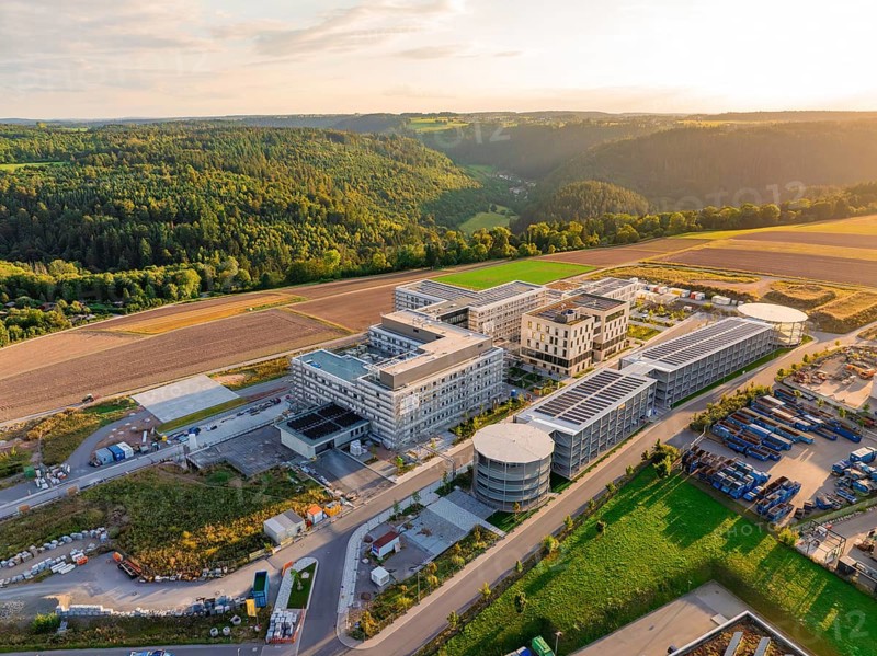 Large-scale building complex inspired by natural surroundings with hills and fields, new hospital building, Calw health campus, Black Forest, Germany