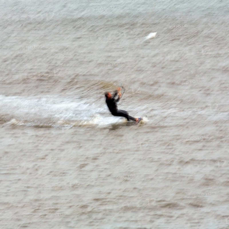 Kitesurfer in the surf, wiping effect, long exposure, Sankt Peter-Ording, Eiderstedt peninsula, Wadden Sea National Park, North Frisia, Schleswig-Holstein, Germany