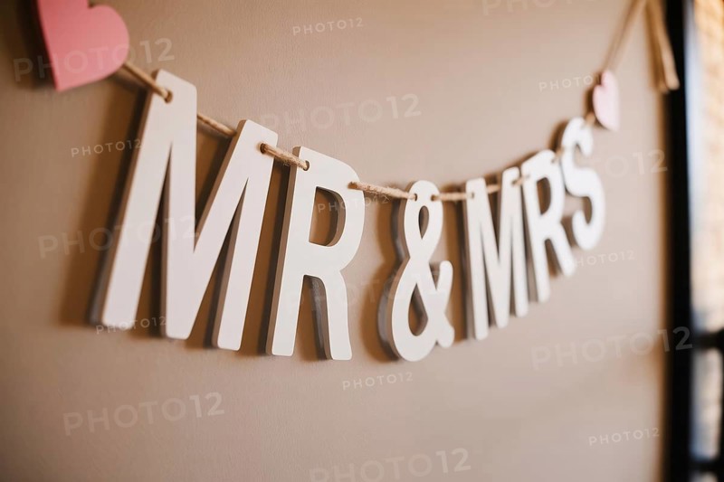 Close up of Mr & Mrs wedding garland with hearts. Romantic wedding decoration detail. Generative ai, AI generated