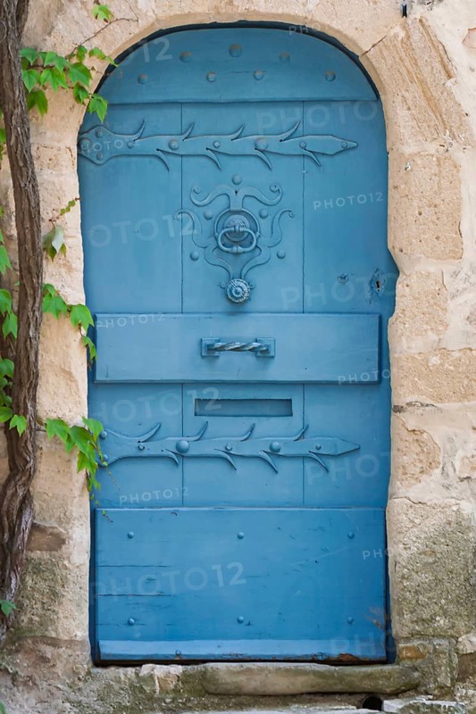 Blue door in a historic house façade, Vaison-la-Romaine, Provence, France