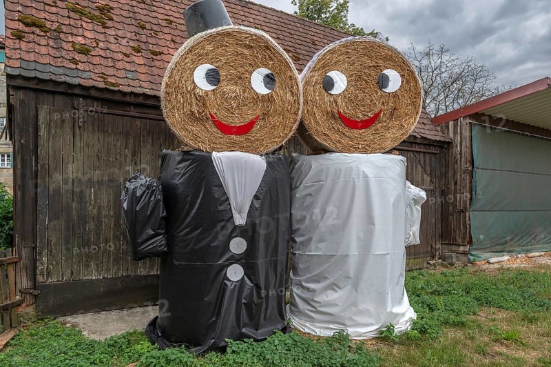 Wedding couple made of straw bales for a wedding celebration, Middle Franconia, Bavaria, Germany