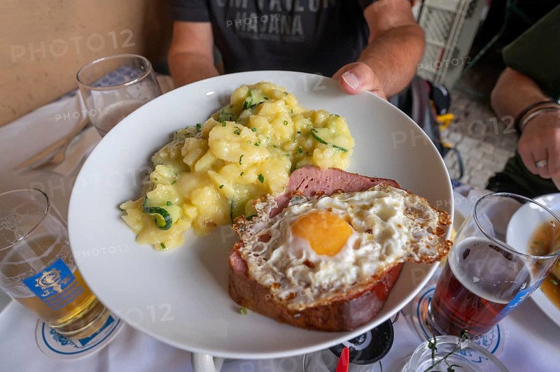 Leberkäse with fried egg and potato salad, served in a beer garden, Munich, Bavaria, Germany