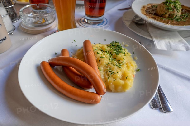 Viennese sausages with potato salad served in a beer garden, Bavaria, Germany