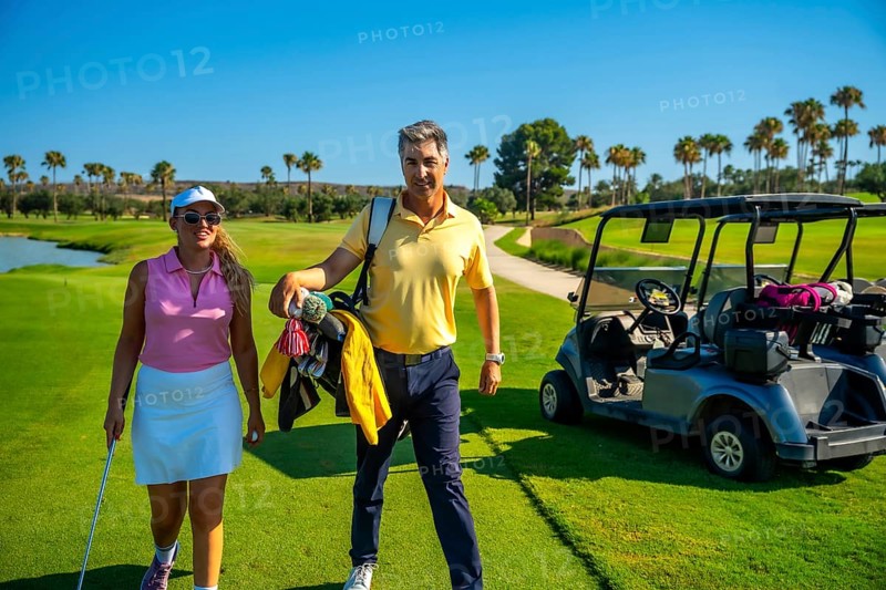 Golfers walking along a stunning golf course, enjoying the sunny day, with a golf cart parked nearby, embodying leisure and active lifestyle