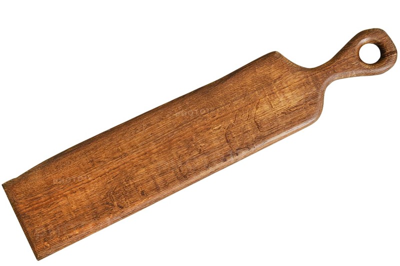 Long and narrow wooden chopping board is displayed on a neutral background. This essential kitchen tool is designed for efficient food preparation, showcasing a simple and rustic charm